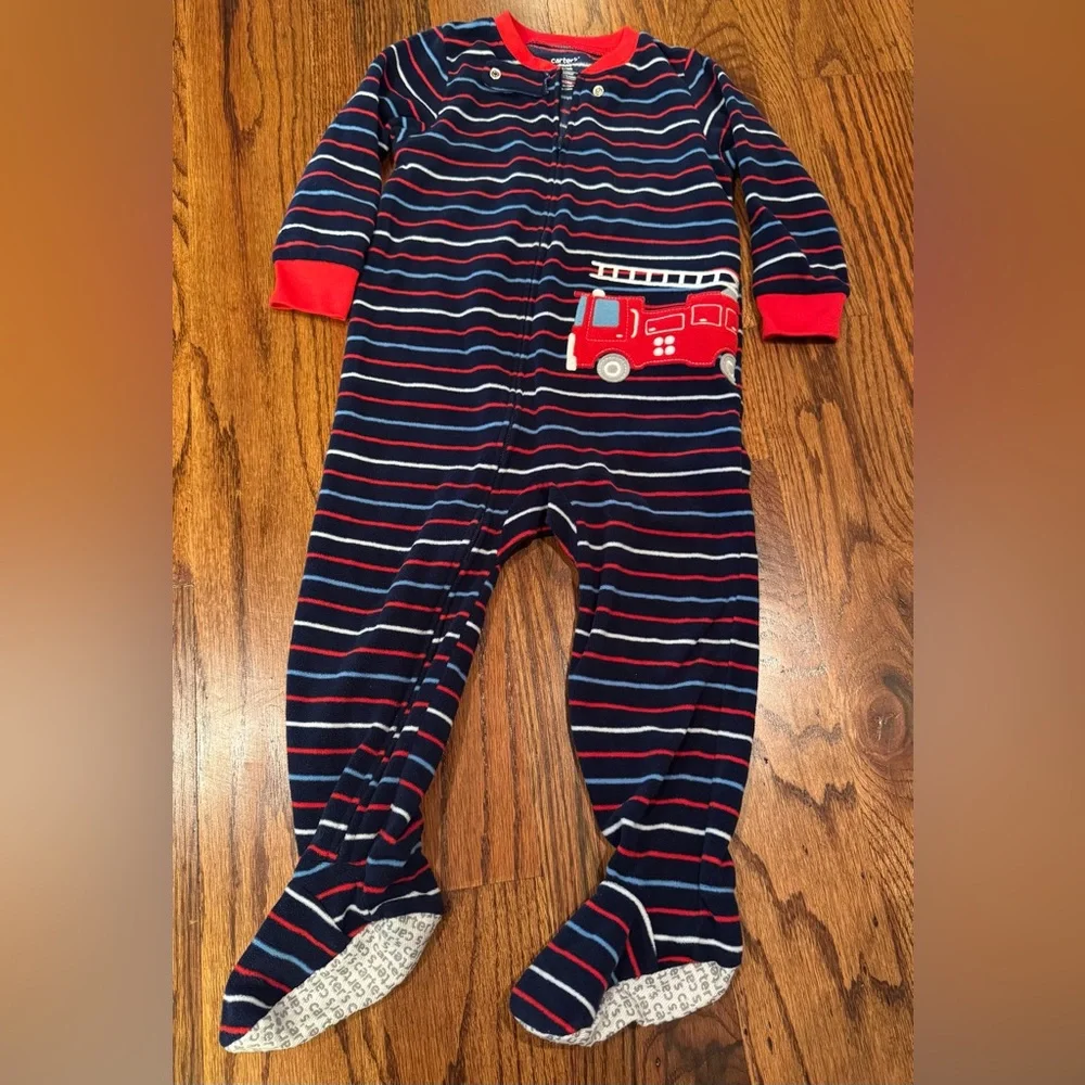 Pair of Carter's fleece PJs with zipper and footies.  Size 24 Months